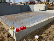 Steel mat in place for structural garage floor. Ready for concrete