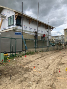 Installing siding on east wall