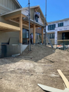 Siding in progress on rear porch gable