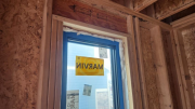 Window gaps are filled with foam for air infiltration control