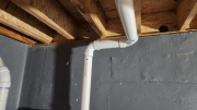 Radon pipe coming from studio crawlspace