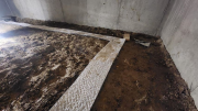 Radon mat system in crawlspace before plastic cover is installed