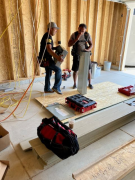 Electricians setting up the service panel