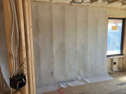 Netting on walls ready for blown-in insulation
