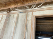Closed cell foam in garage wall to house