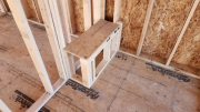 Slightly sloped shower seat in upper bathroom