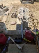 Upper entry retaining wall completed with gravel