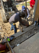 Starting boulder placement for wall around solarium