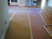 Hallway floor protected with rosin paper & Ram Board
