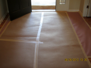 Entry floor protected with Ram Board over rosin paper