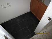 Floor tiles in lower bathroom