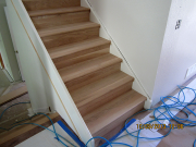 Stairs are finished in matching hardwood