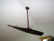 Sleek single blade fan in music room