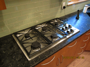 Gas cooktop and glass tile backsplash