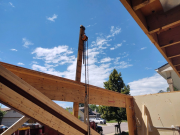 Crane lifting new steel beam