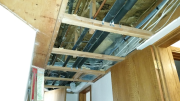 Drywall in hallway was removed for HVAC requirements & inspections