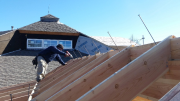 Carlos installing 12 inch rafter screws