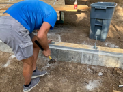 Bolts & 3-inch square washer being installed