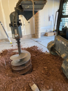 inch auger drilling 50 inches below existing slab
