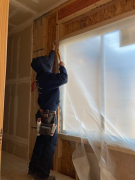 Insulator covering window before foam insulation