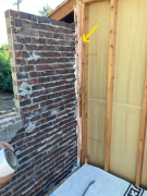 Insulation and foam sealing old wall to brick for air infiltration control